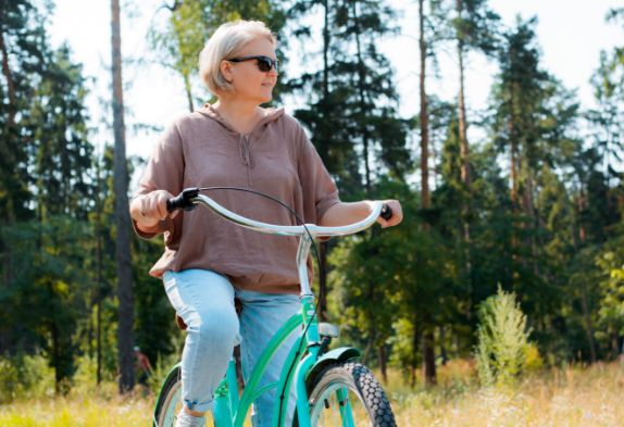 senior-older-elderly-modern-woman-rides-bicycle-city-park-forest-active-pensioner-heal
